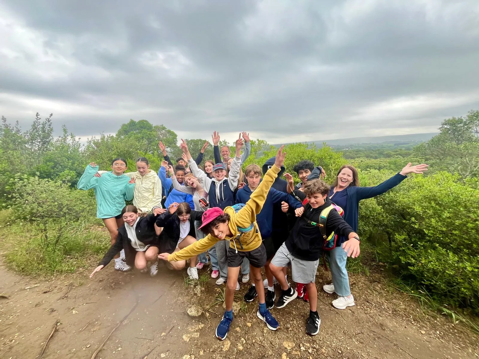 Large hiking group gathered above the Pont du Gard aqueduct
